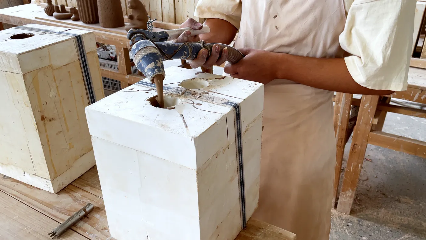 Pouring slip into a plaster mould