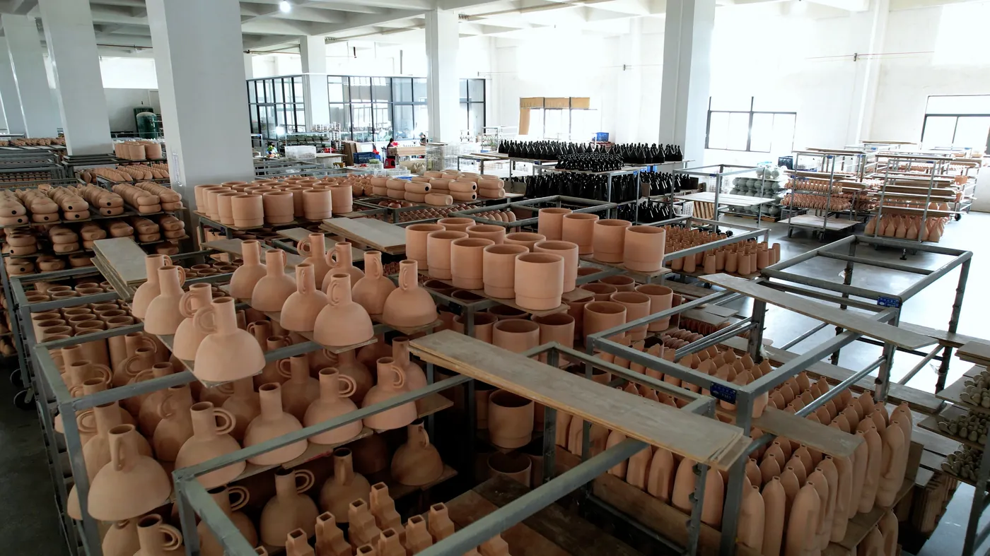 Bisque-fired vases waiting for glaze