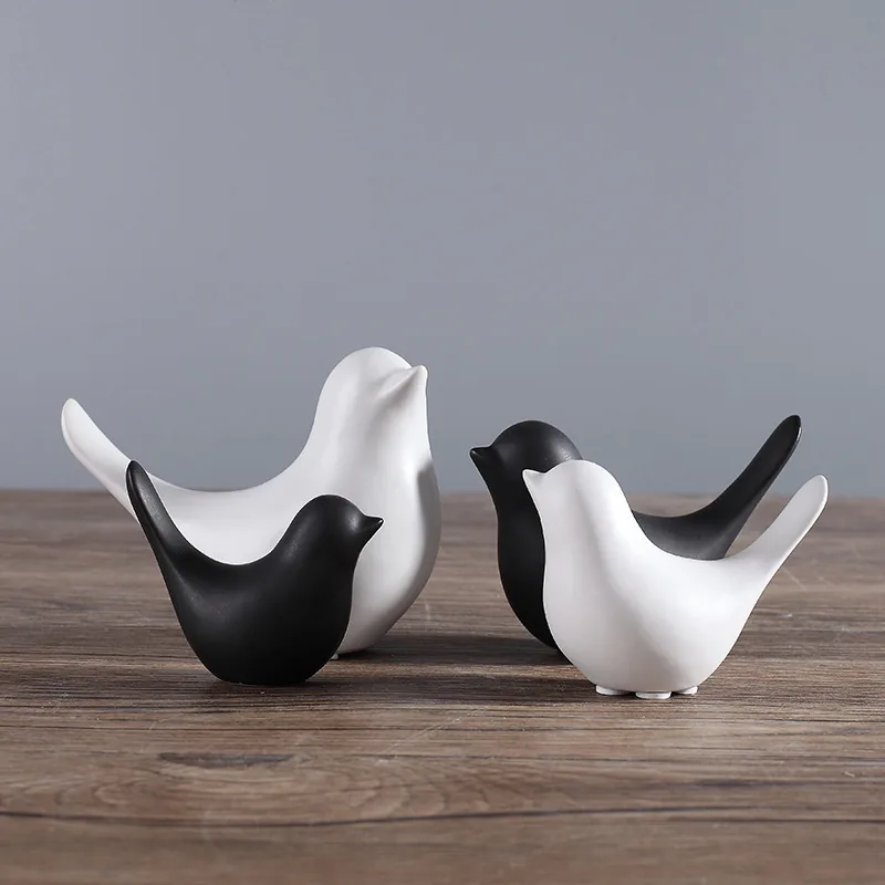 Black and white bird figurines